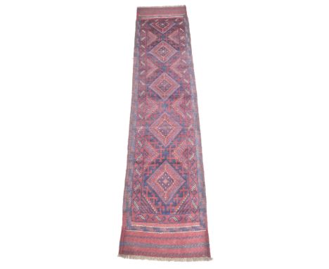 A Meshwari runner, with red and blue geometric ground, five diamond medallions and striped ends, 232 by 57cm. 