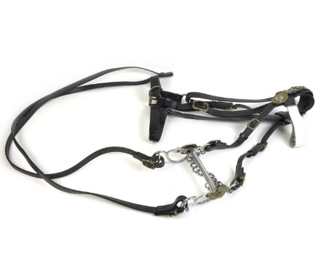 A 20th century British Army style horse bit with leather bridle and Peninsula Waterloo brass marked fittings, and reins. 
