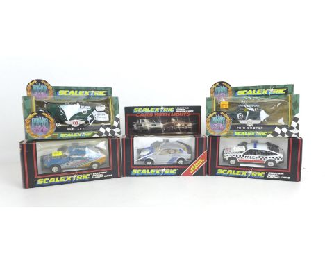 Five Scalextric model racing cars with boxes, comprising two 'Power and the Glory models' a Bentley (C305) and a Mini Cooper 