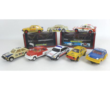 Eight Scalextric model racing cars without boxes, an SRS Mercedes 190E 2.3 16 (C019), a Police Car with roof light (C362), a 