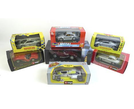 A collection of seven die cast models of sports cars and racing cars, including six 1/24 scale cars, by Maisto, Burago and re