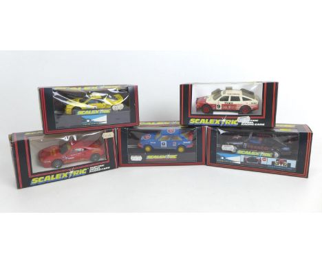 Five Scalextric racing cars, comprising a Ferrari GTO (C391), a Cosworth Texaco (C455), a STP Escort XR3i (C460), a RS 200 Ra