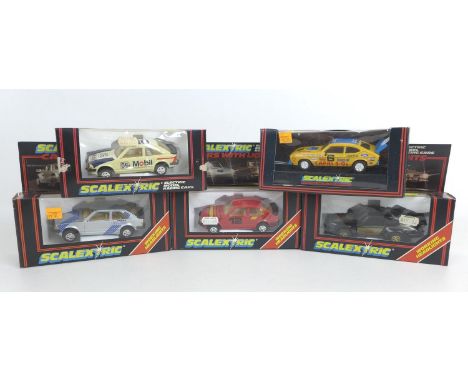 Five Scalextric racing cars three with headlights, A porsche in black (C428), a Ford XR3i in silver (C342), a a Ford XR3i in 