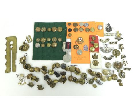 A group of over one hundred British Army badges and buttons, including cap badges for the Essex Regiment, Royal Army Medical 