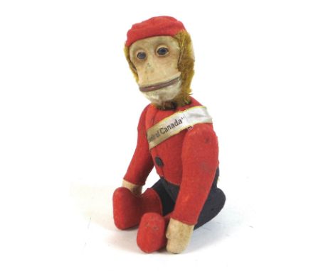 A Schuco articulated model of a monkey, circa 1930, with nodding head swivelling by moving the tail, articulated arms and leg