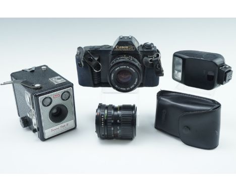 A Canon T50 camera, together with a Canon 50 mm 1:1.8 lens, a 35-70 mm 1:3.5-4.5 lens, a Speedlite 200E, and a Kodak Brownie 