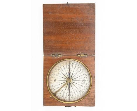 A Georgian mahogany cased pocket compass, having a printed paper rose and a blued steel needle, the transit brake operated by