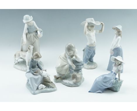 Six Nao figurines, comprising a girl with rabbits, a boy with a stetson, etc, tallest 28 cm 