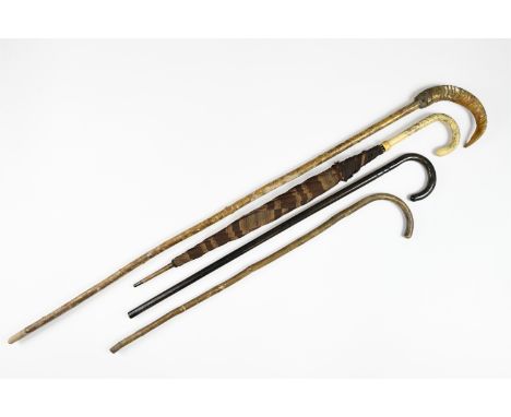 A ram's horn handled walking staff, 120 cm, together with two other vintage walking sticks and an umbrella