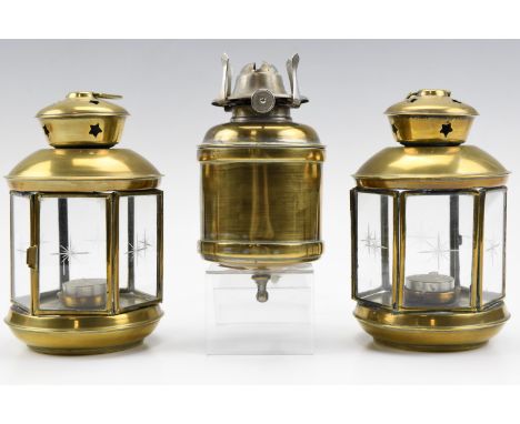 A pair of late 20th Century spun brass hanging tea-light lanterns, having star cut glass sides star pierced vent tops and sus