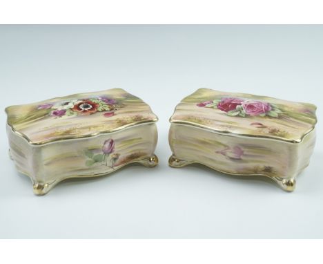 A pair of 1950s Royal Winton candy / trinket boxes, of serpentine form, each having transfer printed floral decoration hand h