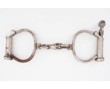 A set of vintage Hiatt "Best Warranted Wrought" Darby type handcuffs with key