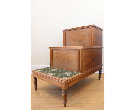 A Regency mahogany step commode, the commode drawer having a hinged cover and retaining its turned wooden inner cover (liner 