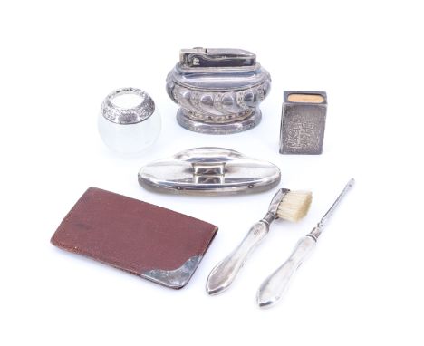 A late Victorian silver matchbox holder, together with a small silver-mounted wallet, a white metal collared glass match pot,