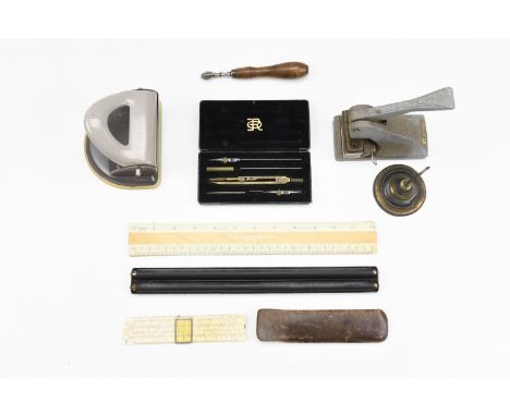 A small quantity of vintage office and drawing equipment including a receipts 'spike', drawing instruments, a parallel rule, 