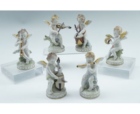 A set of six Sitzendorf figurines of putti playing musical instruments, 20th Century, 10 cm 