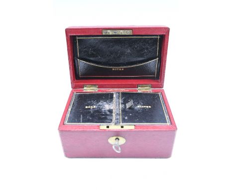 A 19th Century claret leather covered money box, the interior having two compartments with gold tooled descriptions 'gold' an