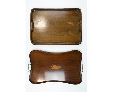 An Edwardian two handled mahogany tea tray, of serpentine form having a banded veneer gallery and marquetry shell inlay, toge