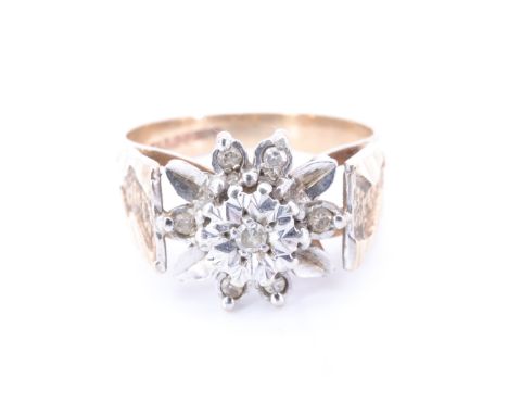 A 1970s diamond and 9 ct gold daisy ring, having an illusion set brilliant diamond, surrounded by petals, six being set with 