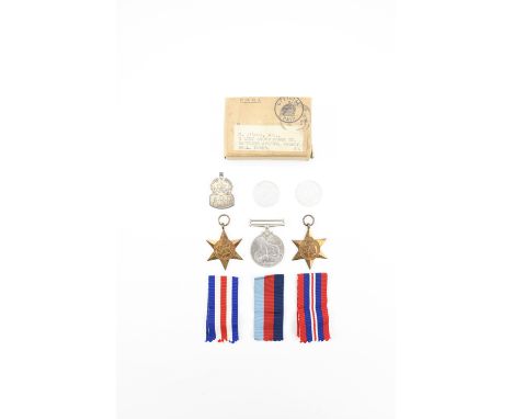 A Second World War campaign medal group in Air Ministry carton, together with two 1944 French coins and a silver ARP badge