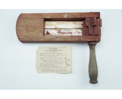 A 1939 ARP rattle, together with associated Army COECDO leaflet