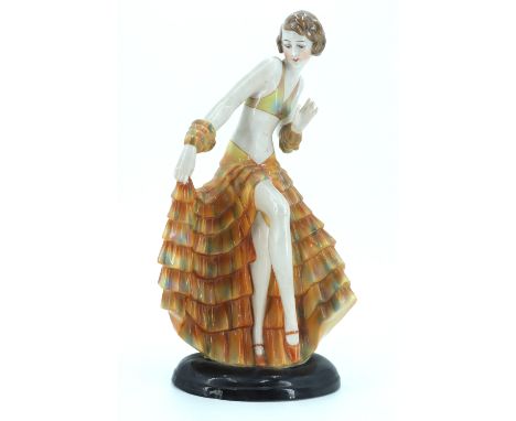 A 1930s Art Deco ceramic figurine of a dancer in the manner of Goldscheider's figures designed by Joseph Lorenzel, the base b