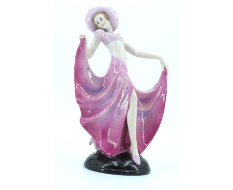 A 1930s Art Deco ceramic figurine of a dancer in the manner of Goldscheider's figures designed by Joseph Lorenzel, the base b