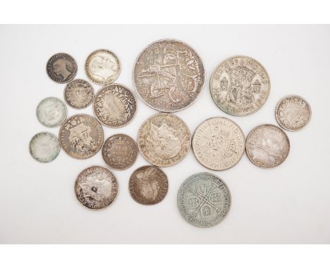 A small group of GB silver coins, George II - George VI, including a 1758 shilling and a 1935 jubilee crown 