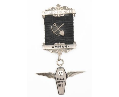 A 1930s Amman Masonic or similar Grand Founder's enamelled silver jewel in the form of a winged coffin bearing a skull device