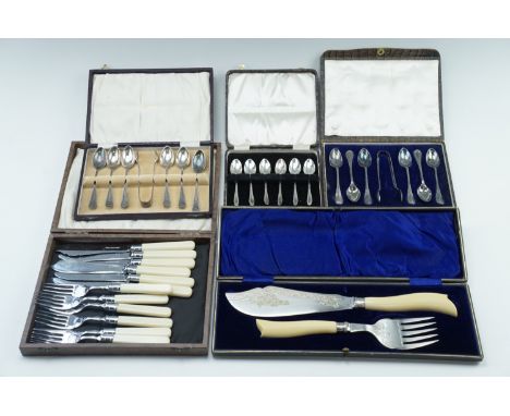 A cased set of early 20th Century Ivorine handled and silver collared fish servers, two cased sets of electroplate teaspoons 