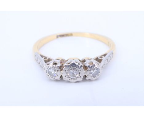 A vintage three stone diamond and 18 ct yellow metal ring, having three illusion set eight-cut diamonds (approximate aggregat