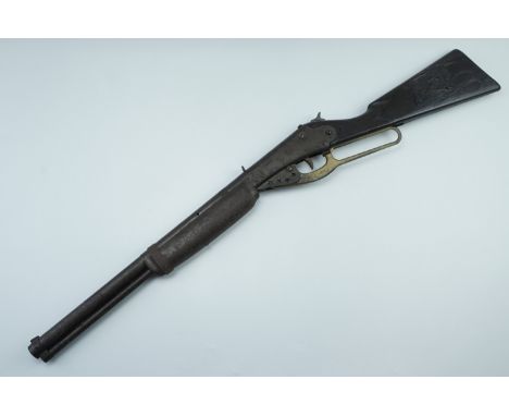 A vintage Daisy type toy gun, having steel construction and a plastic stock depicting a horse's head on one side and a steer 