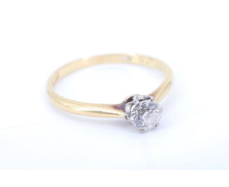 A vintage diamond solitaire ring, having a brilliant cut diamond of approximately 0.36 carat, crown set in white metal betwee