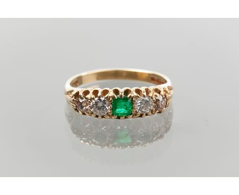 EMERALD AND DIAMOND FIVE STONE RING
with a central square emerald flanked by white and brownish pink diamonds, in eighteen ca