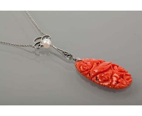 ART DECO CARVED CORAL PENDANT NECKLACE
the coral carved with a bird and floral design, suspended below a pearl, unmarked, on 