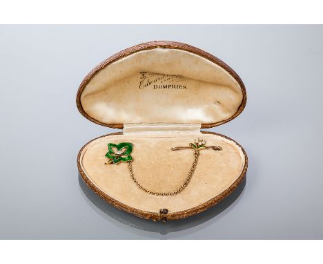 EARLY TWENTIETH CENTURY DIAMOND, PEARL AND ENAMEL LEAF AND FLOWER BROOCH
modelled in two sections joined by a chain, one sect