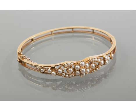 VICTORIAN PEARL SET BANGLE
set with split pearls in a floral design, unmarked