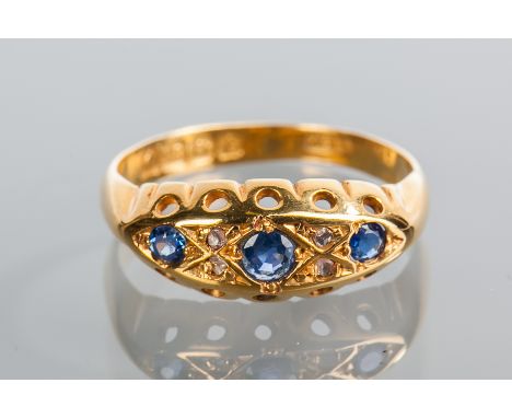 VICTORIAN EIGHTEEN CARAT GOLD SAPPHIRE AND DIAMOND RING
the boat shaped bezel set with round sapphires alternated with diamon