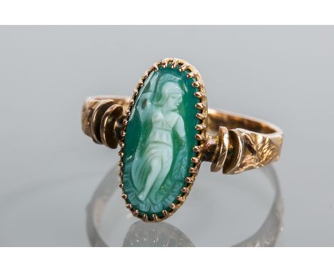 VICTORIAN FIFTEEN CARAT GOLD CAMEO RING
the oval cameo in green depicting the image of a classical soldier, on an ornate engr
