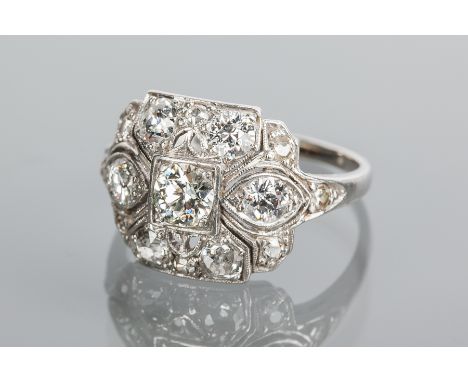 ORNATE EDWARDIAN DIAMOND RING
the bezel set with old brilliant cut diamonds totalling approximately 1.50 carats, the setting 