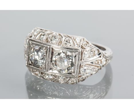 EDWARDIAN DIAMOND DRESS RING
set with two principal round diamonds totalling approximately 1.70 carats, the pierced setting w