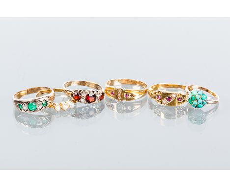 GROUP OF SIX VARIOUS GOLD RINGS
comprising of a Victorian style garnet and white gem set ring in nine carat gold, two ruby an