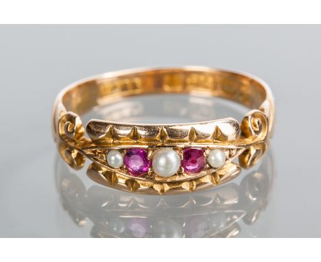 VICTORIAN RUBY AND PEARL RING
the rectangular bezel set with seed pearls and rubies, on ornate scroll motif shoulders, in fif