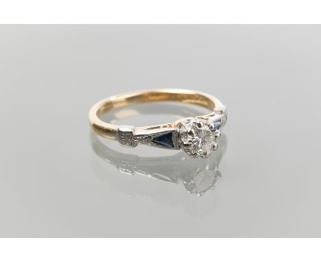 EARLY TO MID TWENTIETH CENTURY DIAMOND SOLITAIRE RING
set with a brilliant cut stone of approximately 0.35 carats flanked by 