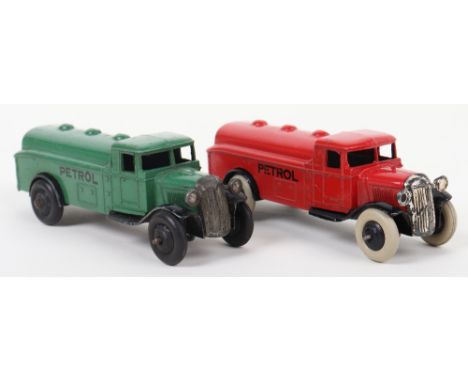 Two Post War Dinky Toys 25d Petrol Tank Wagons, type 2 red body. black ridged wheel hubs and type 3 dark green, black ridged 