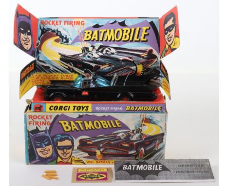 Boxed Corgi Toys 1st issue 267 Rocket Firing Batmobile, gloss black, red bat hubs, blue tinted windscreens, with original "Ba