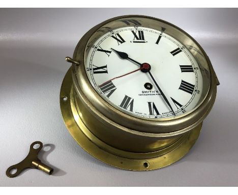 Air Ministry, brass and chrome bulkhead timepiece, Smiths Cricklewood NW2, the drum shaped Brass case with hinged door, to a 