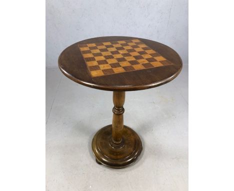 Circular games table, chess board, draughts board, wooden inlay, on turned pedestal and circular base, approx 66cm tall