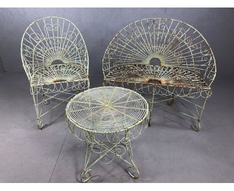 Metalwork vintage garden furniture to include two seater garden bench and armchair with matching table, in a peacock design