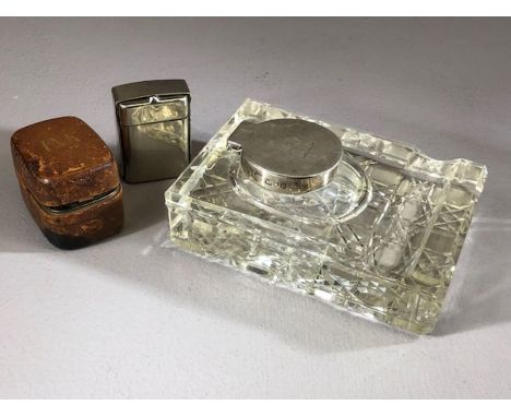 Collection of three inkwells: A leather cased travelling ink well with glass pot. A silver coloured travelling inkwell and a 
